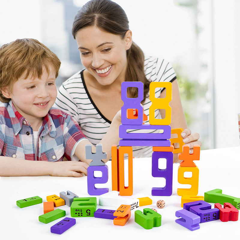 Preschooler using eco-friendly wooden number blocks as learning toys for early math