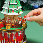 The assembled wooden music box displayed as a charming holiday decoration in a cozy home setting