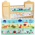 Newborn baby looking at a double-sided contrast book attached to the crib for visual development