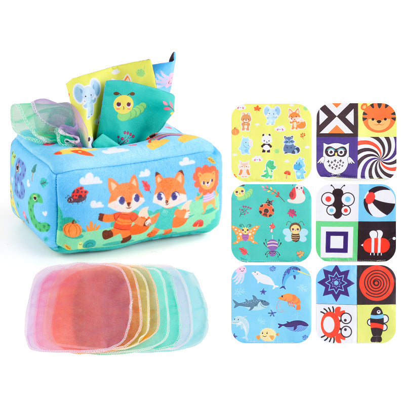 Baby playing with a Montessori-inspired sensory tissue box toy, developing fine motor skills and visual focus