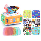 Baby playing with a Montessori-inspired sensory tissue box toy, developing fine motor skills and visual focus