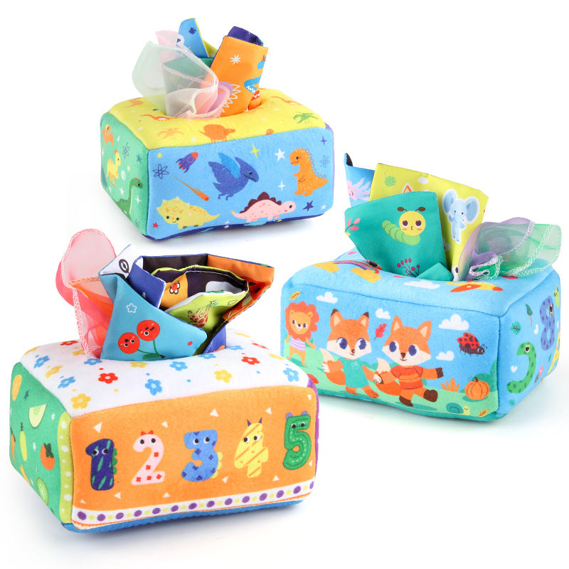 Baby playing with a Montessori-inspired sensory tissue box toy, developing fine motor skills and visual focus