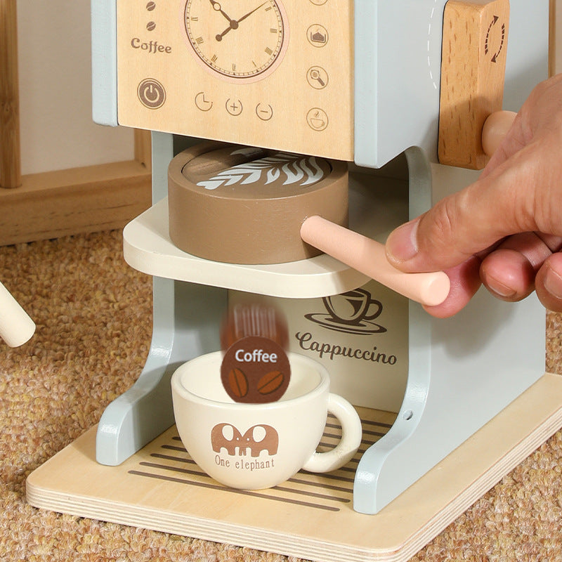 Toy espresso machine with pressable milk frother and wooden coffee pods