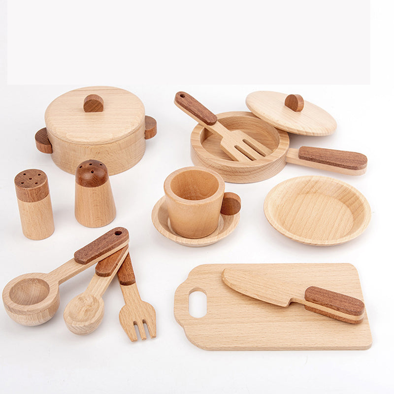 Toddler using kitchen playset to imitate cooking with parents