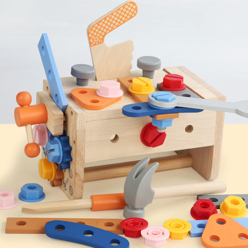 Toddler using wooden hammer and screwdriver for fine motor skill development