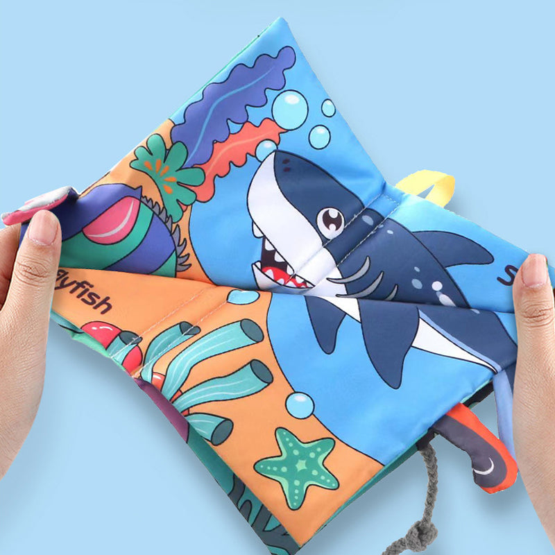 Toddler aggressively tugging indestructible fabric book pages 🛡️ | Tear-proof material keeps shape after rough play 💪